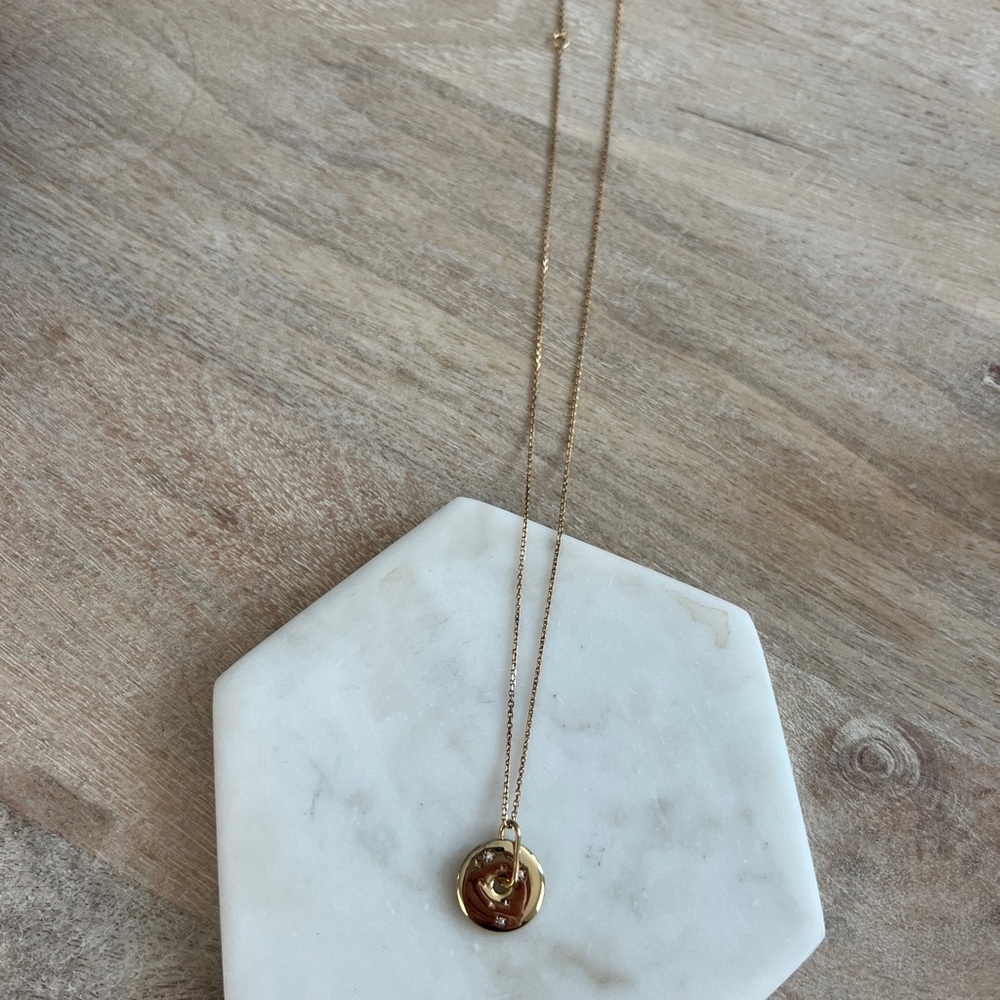 Mejuri zodiac sign Leo pendant necklace